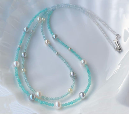 Akoya pearl layered necklace with 19 pearls in sea and sky colors showcasing transparency and unique design