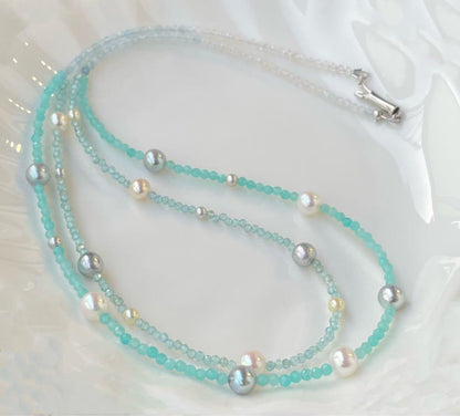 Akoya pearl layered necklace with 19 pearls in sea and sky colors showcasing transparency and unique design