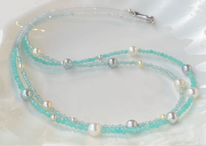 Akoya pearl layered necklace with 19 pearls in sea and sky colors showcasing transparency and unique design