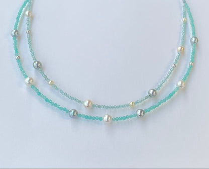 Akoya pearl layered necklace with 19 pearls in sea and sky colors showcasing transparency and unique design