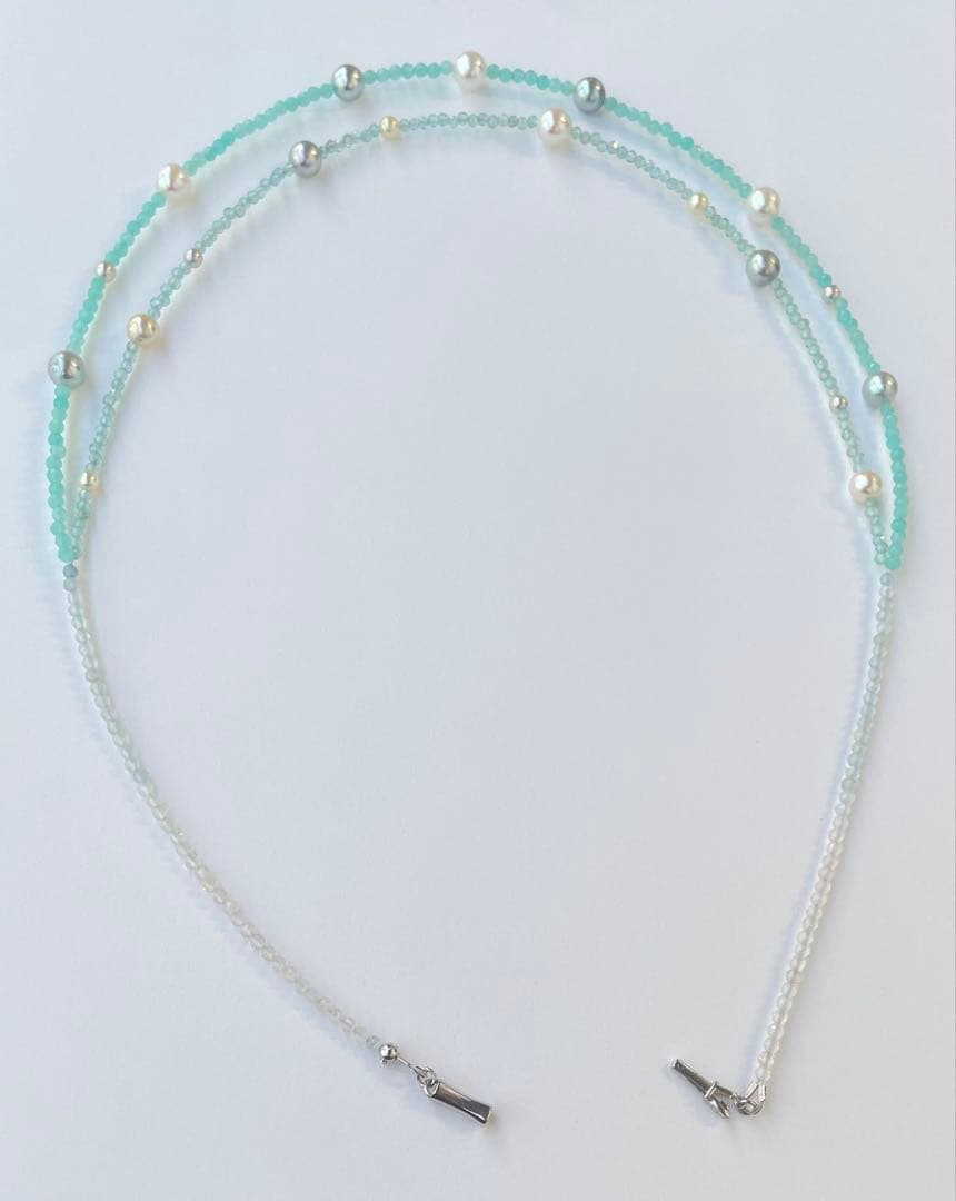 Akoya pearl layered necklace with 19 pearls in sea and sky colors showcasing transparency and unique design