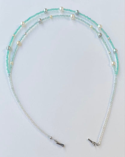 Akoya pearl layered necklace with 19 pearls in sea and sky colors showcasing transparency and unique design