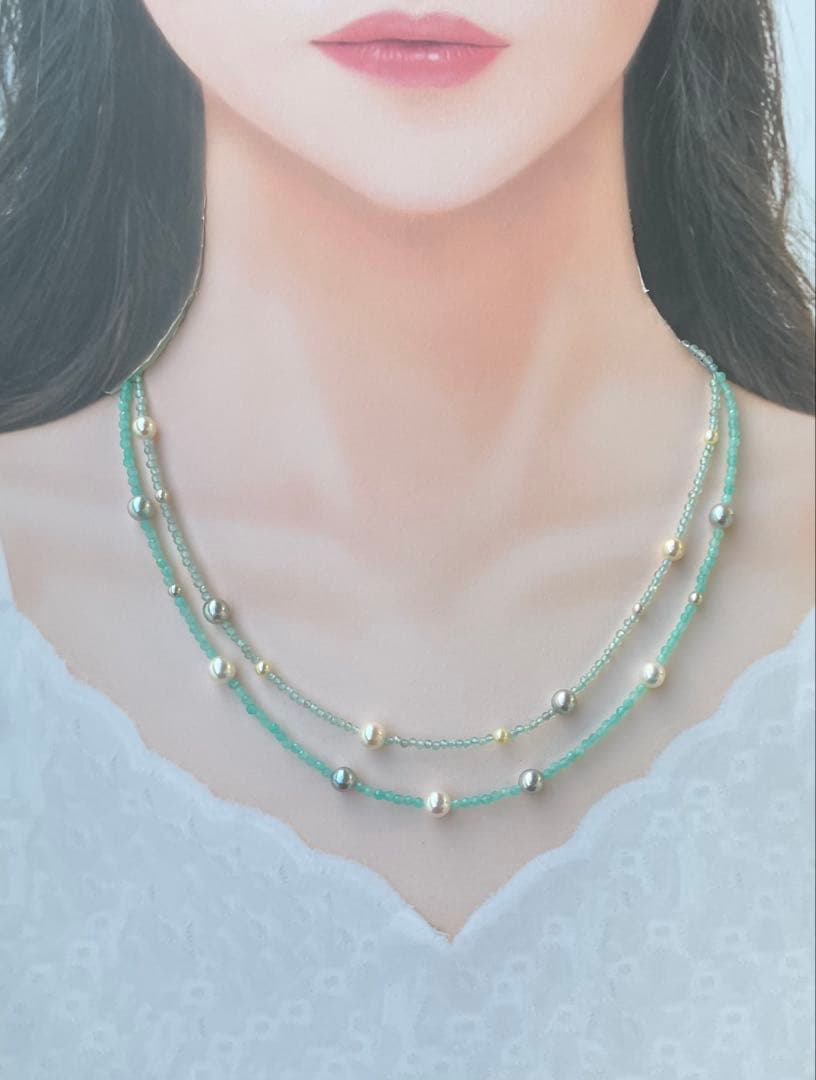Akoya pearl layered necklace with 19 pearls in sea and sky colors showcasing transparency and unique design
