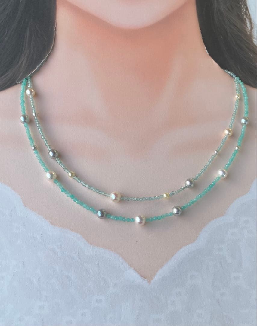 Akoya pearl layered necklace with 19 pearls in sea and sky colors showcasing transparency and unique design