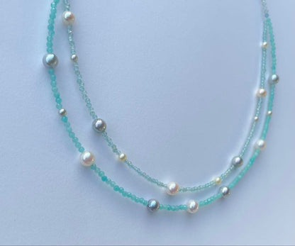 Akoya pearl layered necklace with 19 pearls in sea and sky colors showcasing transparency and unique design