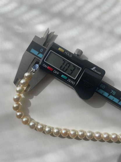 Akoya pearl necklace with genuine ivory pearls sized 8.6-7.0mm, 82cm long with clasp
