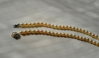 Akoya pearl necklace with genuine ivory pearls sized 8.6-7.0mm, 82cm long with clasp