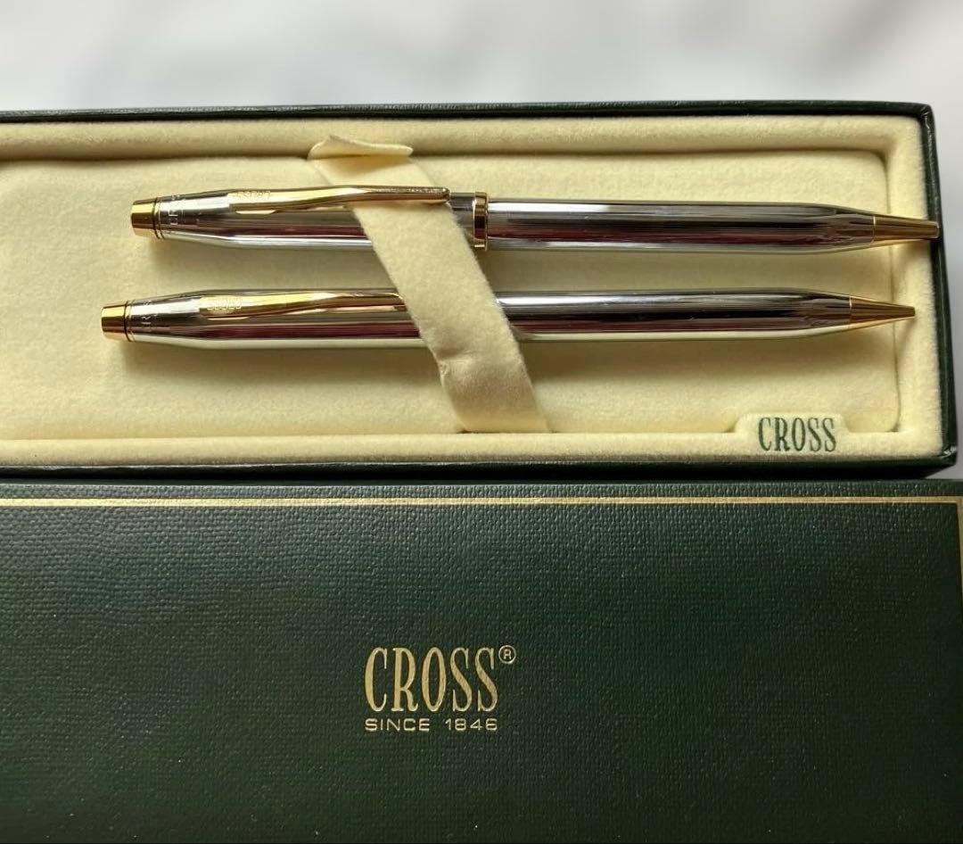 Cross ballpoint pen and mechanical pencil set with sleek silver finish on white background