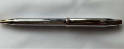 Cross ballpoint pen and mechanical pencil set with sleek silver finish on white background