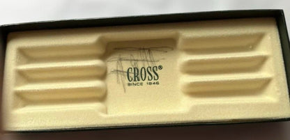 Cross ballpoint pen and mechanical pencil set with sleek silver finish on white background