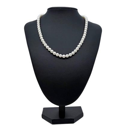 Tasaki Akoya Pearl Necklace featuring 7mm round pearls and a silver clasp on a white background