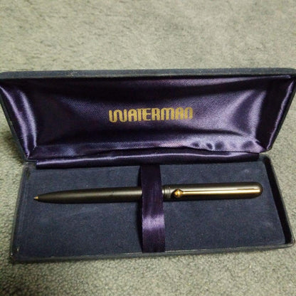 Waterman Ballpoint Pen approximately 13 cm long with black barrel and silver accents