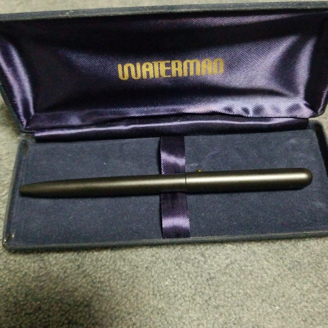 Waterman Ballpoint Pen approximately 13 cm long with black barrel and silver accents