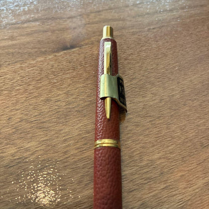 New PILOT high-end ballpoint pen with brown leather-like body and gold accents, fine point tip, black ink