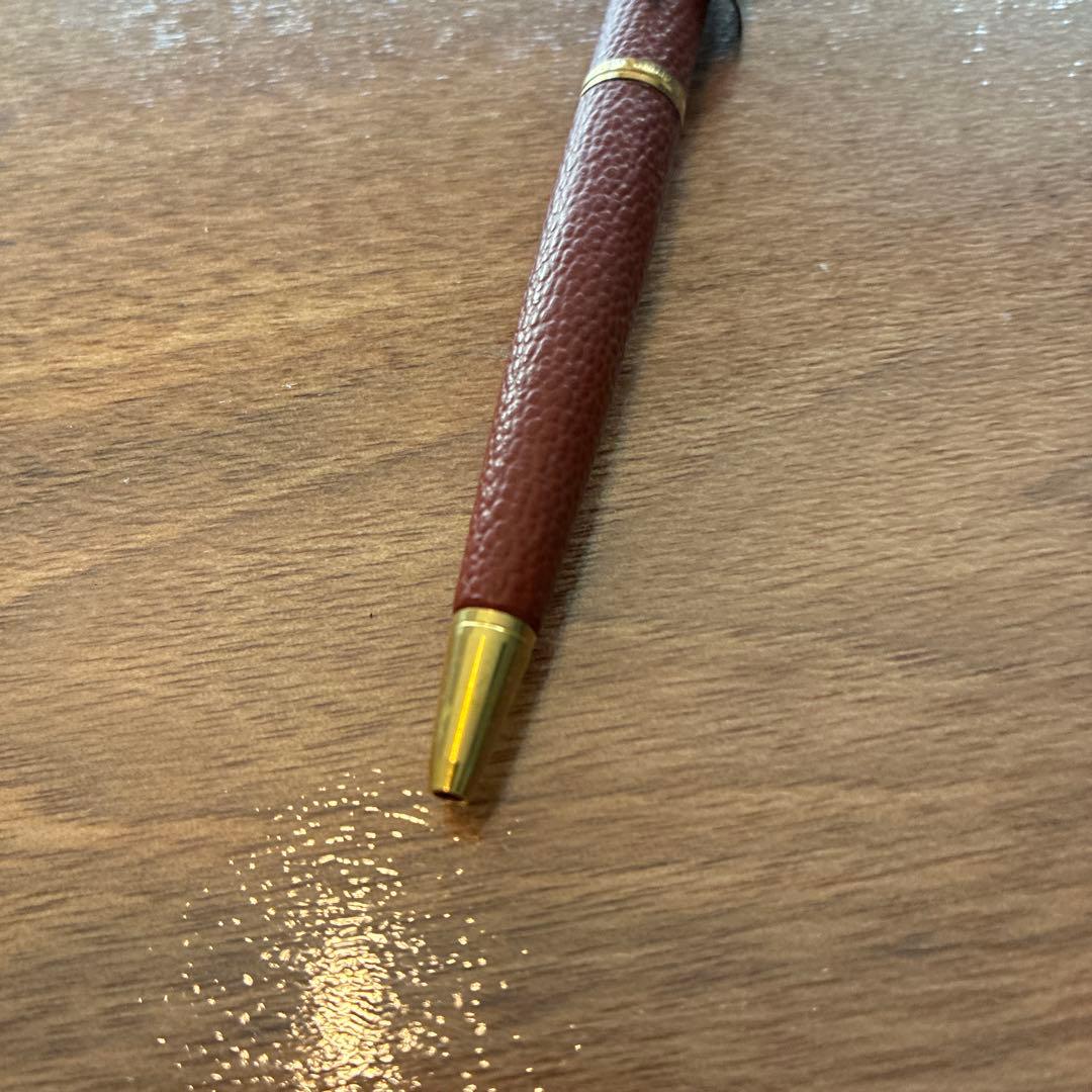New PILOT high-end ballpoint pen with brown leather-like body and gold accents, fine point tip, black ink