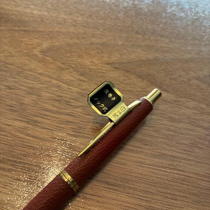 New PILOT high-end ballpoint pen with brown leather-like body and gold accents, fine point tip, black ink