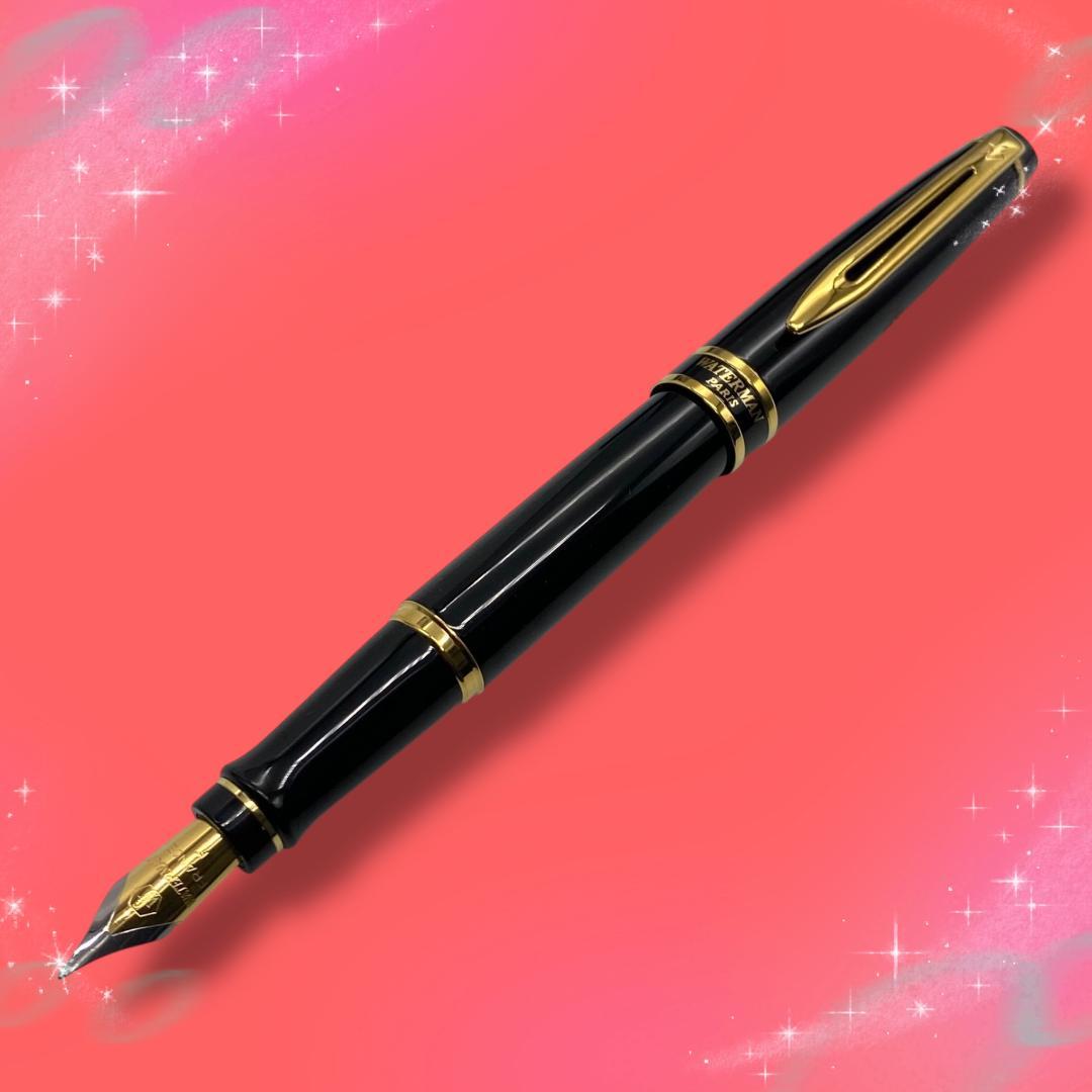 Waterman Expert Essential fountain pen with fine nib in black and gold, displayed with box and replacement cartridge