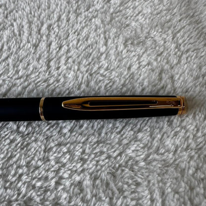 Black Waterman Paris ballpoint pen with included case shown on a white background