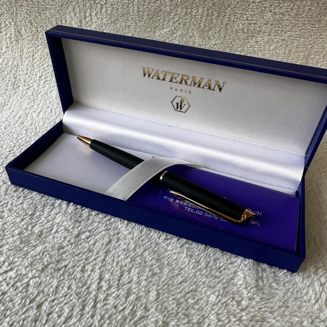 Black Waterman Paris ballpoint pen with included case shown on a white background