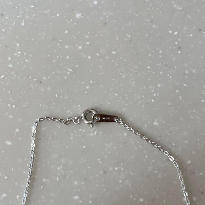 MIKIMOTO necklace featuring silver chain and white pearls with box, card, and pouch accessories