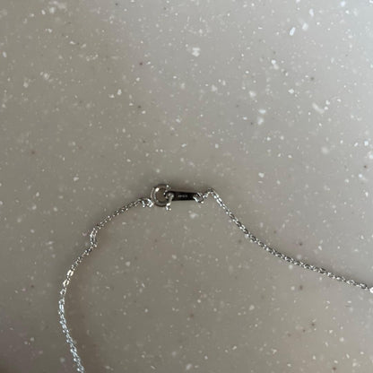 MIKIMOTO necklace featuring silver chain and white pearls with box, card, and pouch accessories