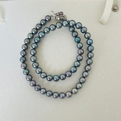 Akoya black pearl necklace with 7.5mm round peacock green pearls on a 43cm silver chain