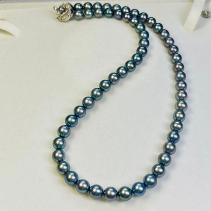 Akoya black pearl necklace with 7.5mm round peacock green pearls on a 43cm silver chain