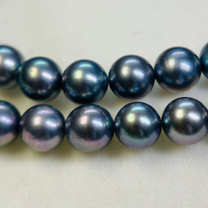 Akoya black pearl necklace with 7.5mm round peacock green pearls on a 43cm silver chain