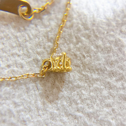 Agete K18 gold necklace with a 0.05ct diamond pendant on a delicate chain