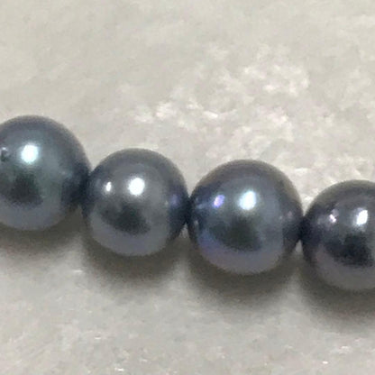 Akoya pearl necklace with small round blue-grey pearls on a 40cm strand with sterling silver clasp