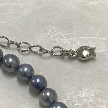 Akoya pearl necklace with small round blue-grey pearls on a 40cm strand with sterling silver clasp