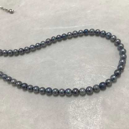 Akoya pearl necklace with small round blue-grey pearls on a 40cm strand with sterling silver clasp