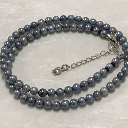 Akoya pearl necklace with small round blue-grey pearls on a 40cm strand with sterling silver clasp