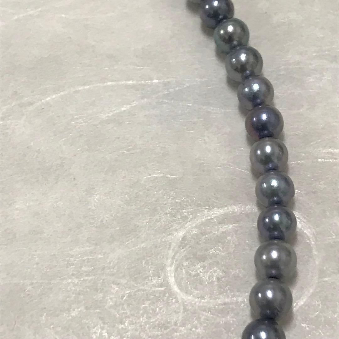 Akoya pearl necklace with small round blue-grey pearls on a 40cm strand with sterling silver clasp