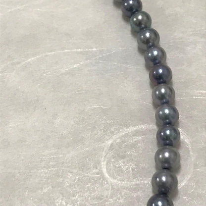 Akoya pearl necklace with small round blue-grey pearls on a 40cm strand with sterling silver clasp