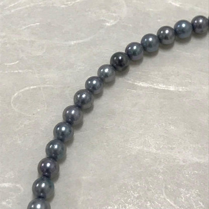Akoya pearl necklace with small round blue-grey pearls on a 40cm strand with sterling silver clasp
