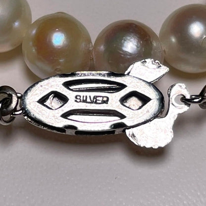 Akoya pearl semi-baroque necklace 7.0-7.4mm white pearls on silver chain length 39.1 cm