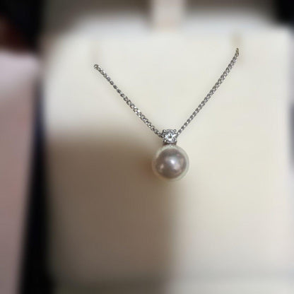 TASAKI pearl necklace with 8.1mm white pearl and 0.11ct diamond pendant on a fine chain