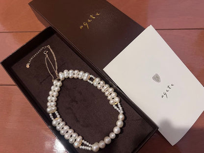 Agete pearl necklace with two-layered design combining large and small 10k pearls