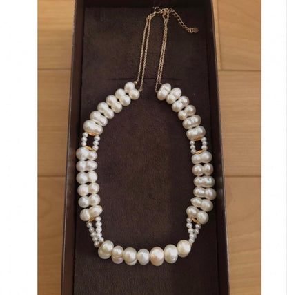 Agete pearl necklace with two-layered design combining large and small 10k pearls