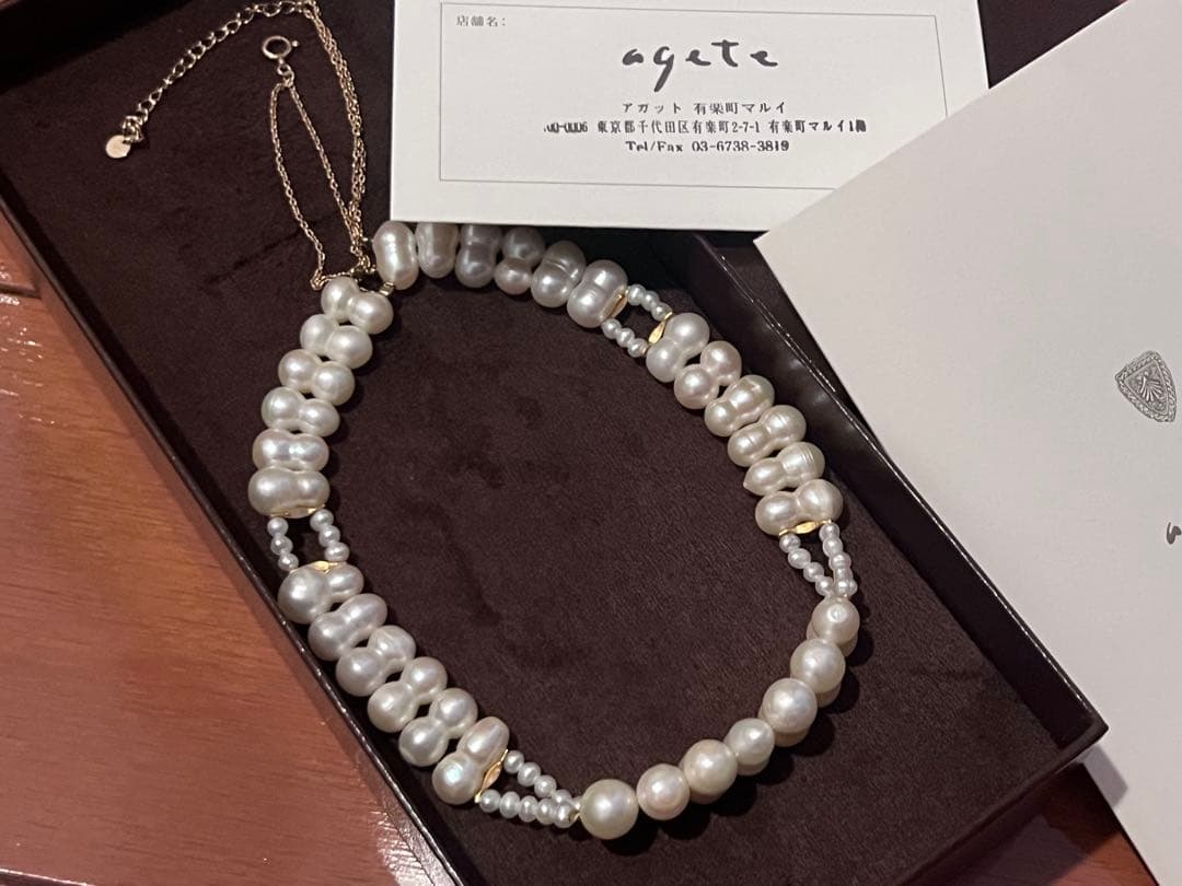 Agete pearl necklace with two-layered design combining large and small 10k pearls