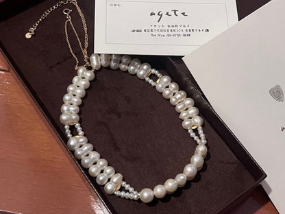 Agete pearl necklace with two-layered design combining large and small 10k pearls