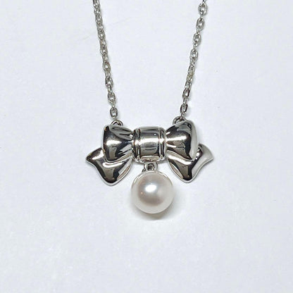 Mikimoto Akoya pearl necklace with 6.7mm pearls and silver ribbon motif pendant on 38.5cm chain