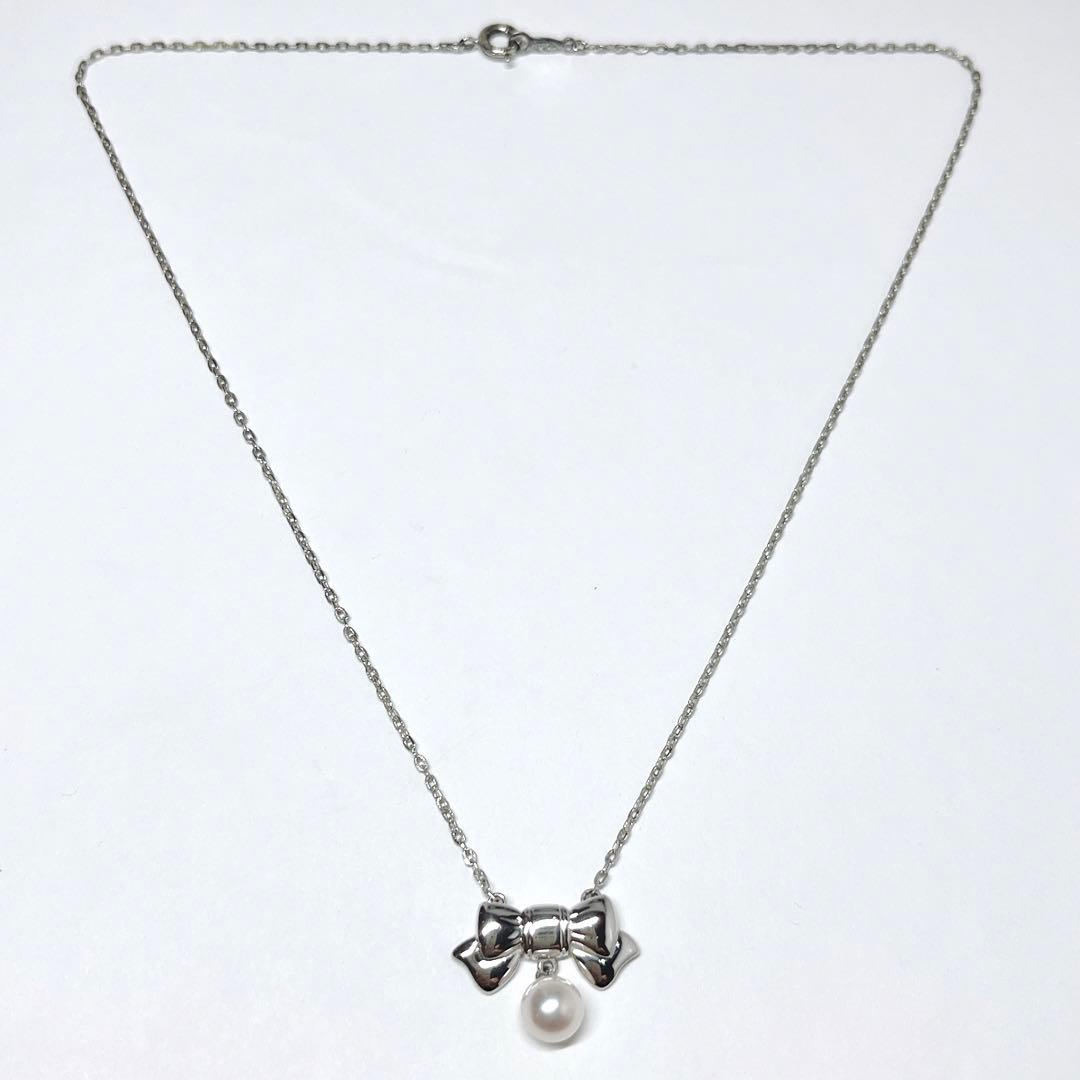 Mikimoto Akoya pearl necklace with 6.7mm pearls and silver ribbon motif pendant on 38.5cm chain