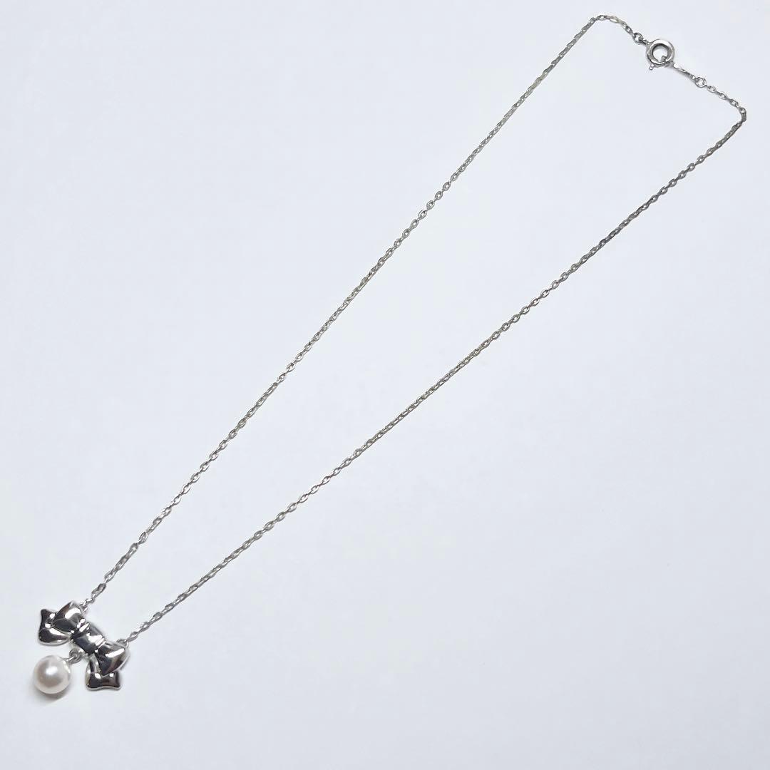 Mikimoto Akoya pearl necklace with 6.7mm pearls and silver ribbon motif pendant on 38.5cm chain