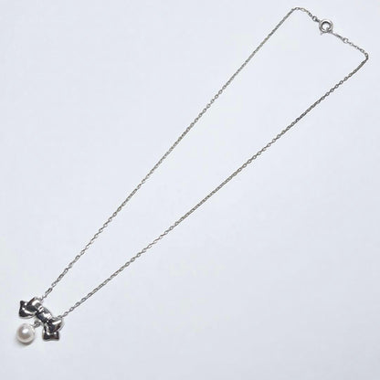 Mikimoto Akoya pearl necklace with 6.7mm pearls and silver ribbon motif pendant on 38.5cm chain