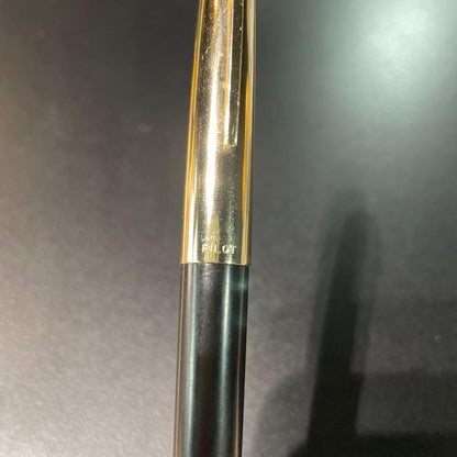 Pilot fountain pen with black and gold body featuring HK K14 engraving