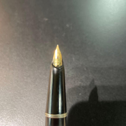 Pilot fountain pen with black and gold body featuring HK K14 engraving