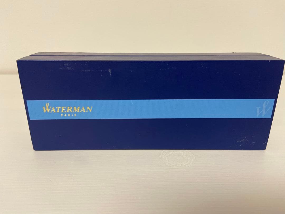 Waterman ballpoint pen with blue ink metal body, box, and instruction manual, lightly used condition