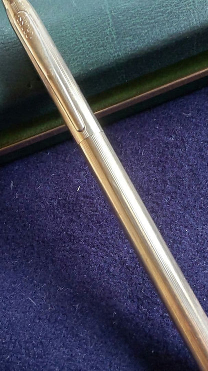 Cross ballpoint pen with 10K gold plating and black ink, measuring 13 cm long